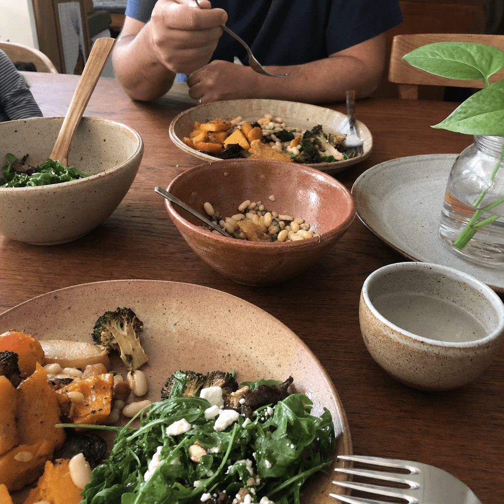 Maison Lede stoneware bowls on a table mid-meal, natural daylight